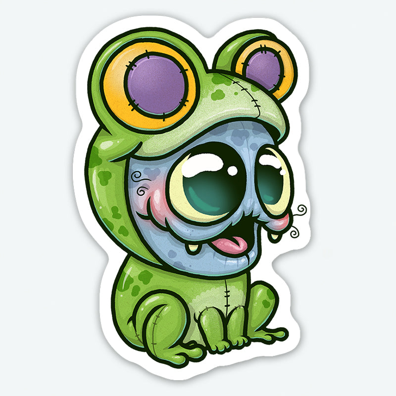 Add whimsical charm to any surface with the Frog Suit Sticker from Bindlewood Shop—a durable matte vinyl sticker featuring a blue creature in a green frog costume with bright eyes and a long pink tongue.
