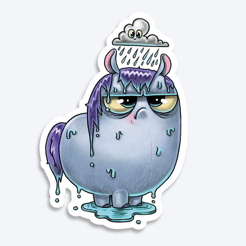 The Soggy Pony Sticker from Bindlewood Shop features a cartoonish blue creature with small horns, a purple mane and tail, and a grumpy face standing in a puddle—perfect as a matte finish vinyl sticker inspired by Chris Ryjniak’s style.