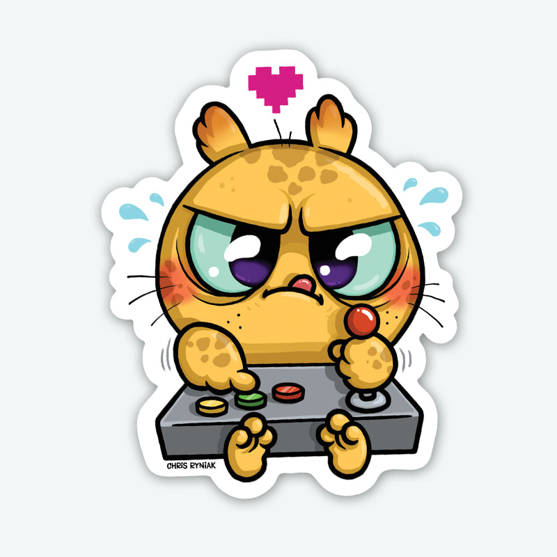 The Bindlewood Shop Gamer Sticker shows a cute, chubby cartoon cat intensely playing an arcade game with blushing cheeks and sweat drops. This durable vinyl sticker features a pink pixel heart and a smooth matte finish for extra charm.