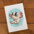A drawing of a cartoon character from Bindlewood on a wood surface featuring the "Axolotl" print by Chris Ryniak.