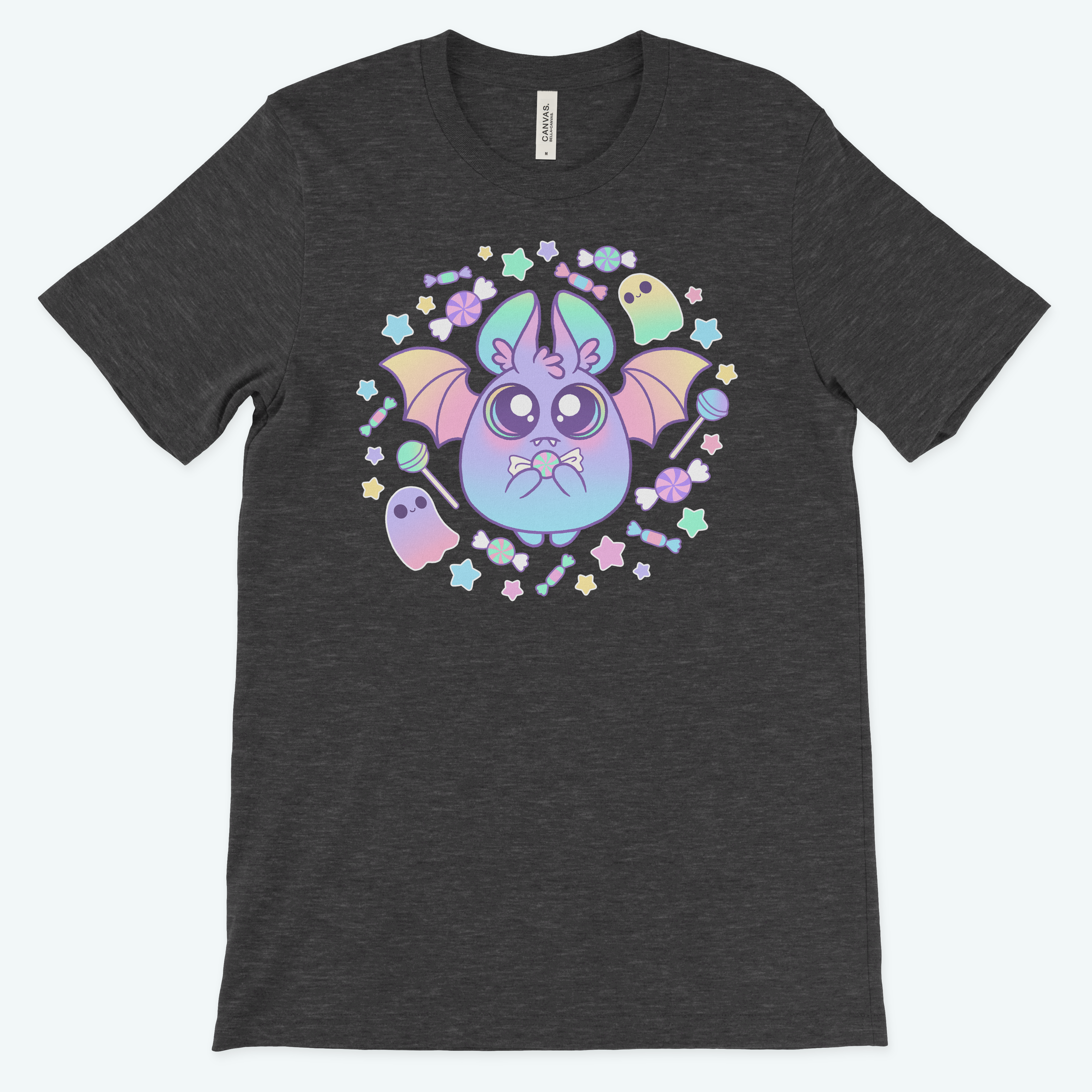 The Bindlewood Shop Pastel Candy Bat Tee is a dark gray, gender-neutral shirt with a cute pastel bat, stars, and two smiling ghosts in purple, green, yellow, and blue.