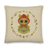 The Bindlewood Shop's Garden Sprite Throw Pillow is a charming rustic addition to any cottagecore interior design. It features a whimsical illustration of a large-eyed Garden Sprite wearing a red hood and green dress adorned with floral patterns. The character is surrounded by a circular arrangement of small flowers, leaves, and mushrooms, making it an enchanting accent piece for your home decor.