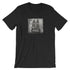 The Pipsqueak Mugshot Tee from Bindlewood Shop features a cartoon rabbit in a vintage mugshot, wide-eyed before a height chart and holding police sign “315154.” This shirt offers a gender-neutral fit and unique character style.